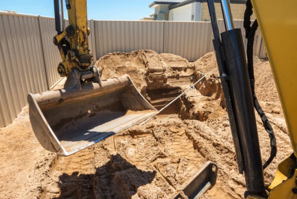 Excavation works for the installation of a swimming pool.Swimming pool under construction.